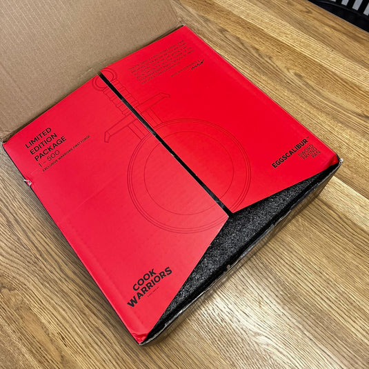 Red box with 'Cook Warriors' branding on a wooden table Eggscalibur buy now